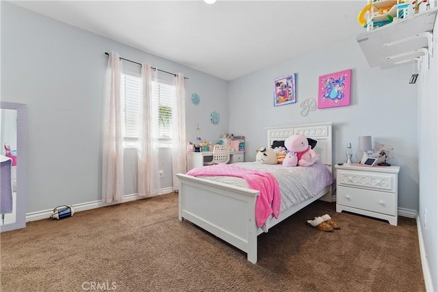 carpeted bedroom with baseboards