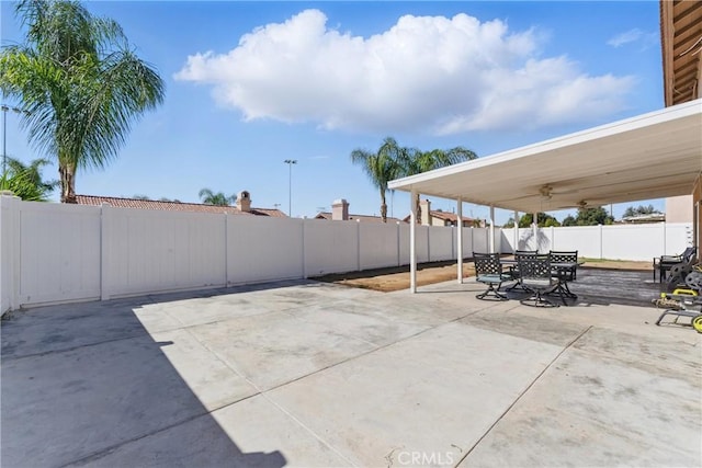 view of patio featuring a fenced backyard and outdoor dining space