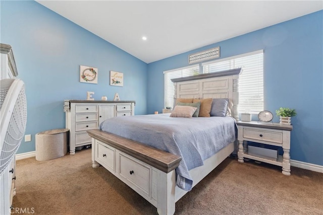 carpeted bedroom featuring baseboards and vaulted ceiling
