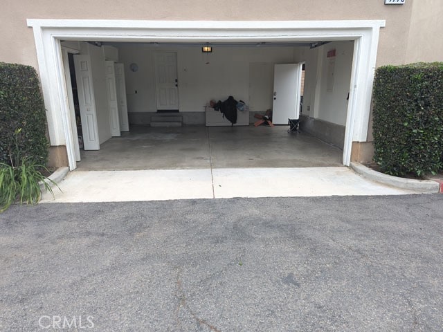 9770 Winterberry Dr, Riverside, CA 92803 - garage featuring driveway