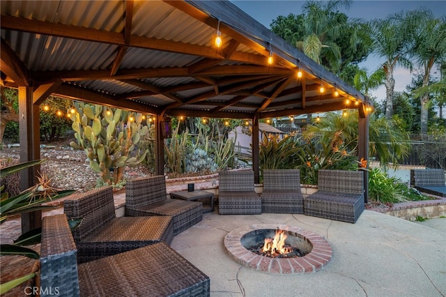 view of patio with a gazebo and an outdoor fire pit