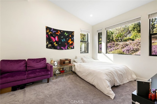 carpeted bedroom featuring recessed lighting and vaulted ceiling