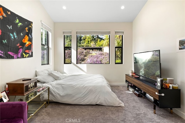 carpeted bedroom with lofted ceiling, recessed lighting, and baseboards