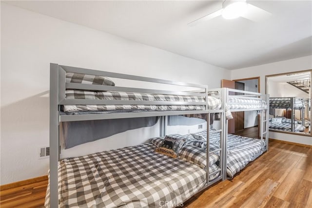 bedroom featuring wood finished floors and ceiling fan