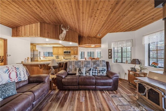 living room featuring lofted ceiling, wood ceiling, and wood finished floors