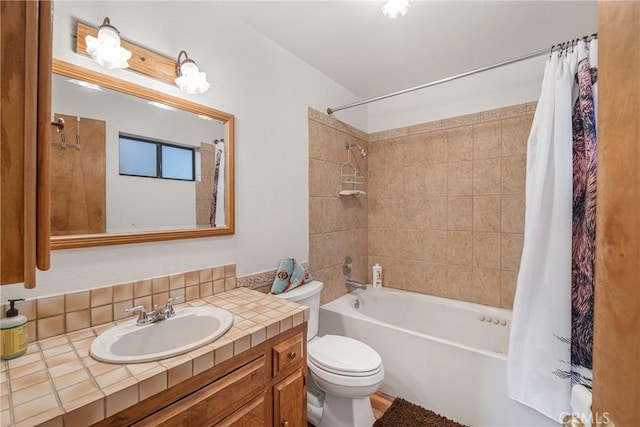 bathroom with vanity, toilet, and shower / bath combo with shower curtain