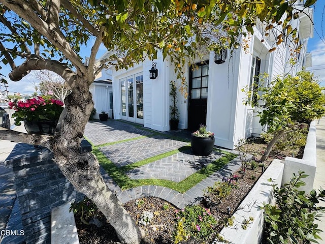 view of home's exterior featuring a patio and french doors