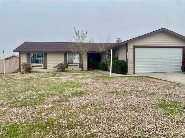 ranch-style home featuring fence, driveway, an attached garage, a chimney, and a front lawn