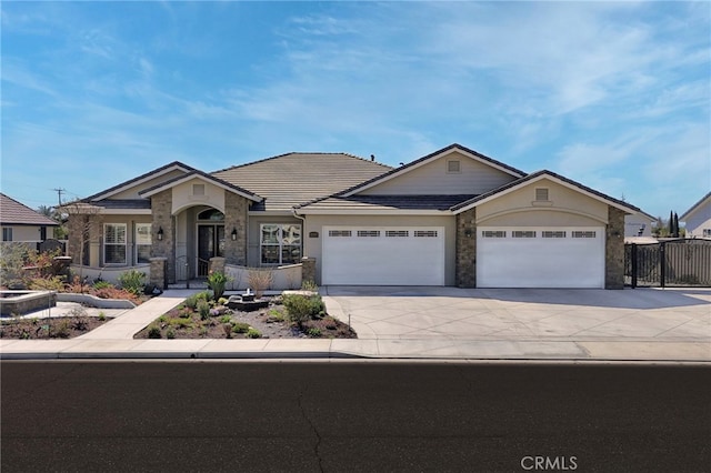 view of front of home featuring a garage, stone siding, concrete driveway, and stucco siding