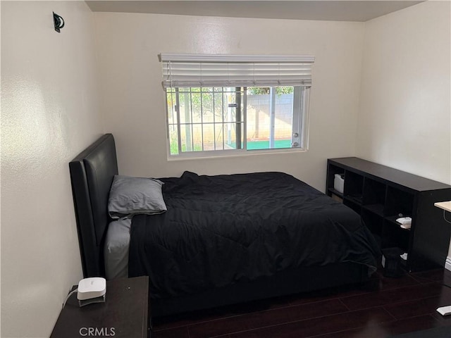 bedroom featuring wood finished floors