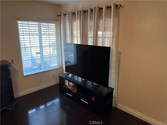 living area with dark wood finished floors and baseboards