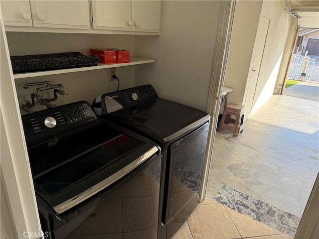 laundry room with washer and dryer and cabinet space