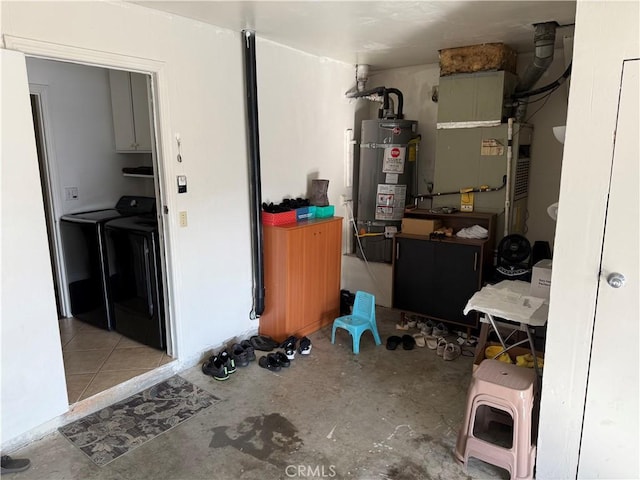 interior space featuring washer and dryer and strapped water heater