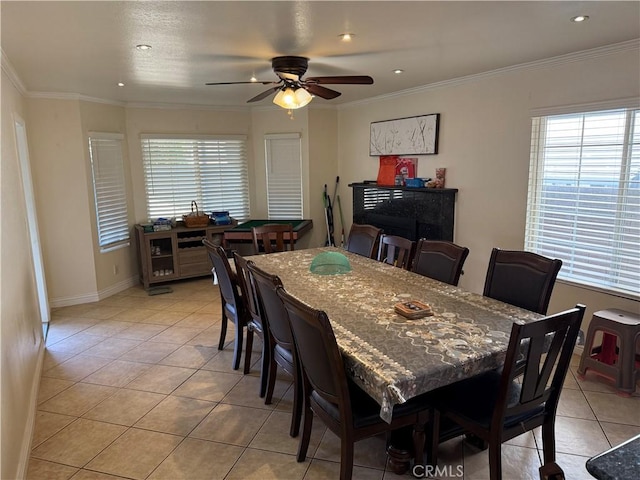 dining area featuring light tile patterned flooring, a ceiling fan, and ornamental molding