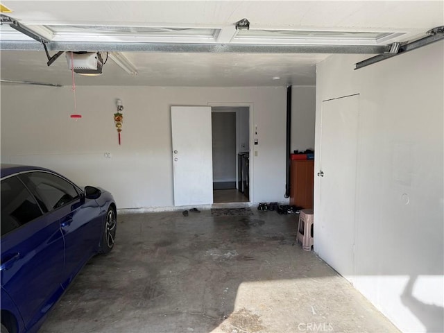 garage featuring a garage door opener