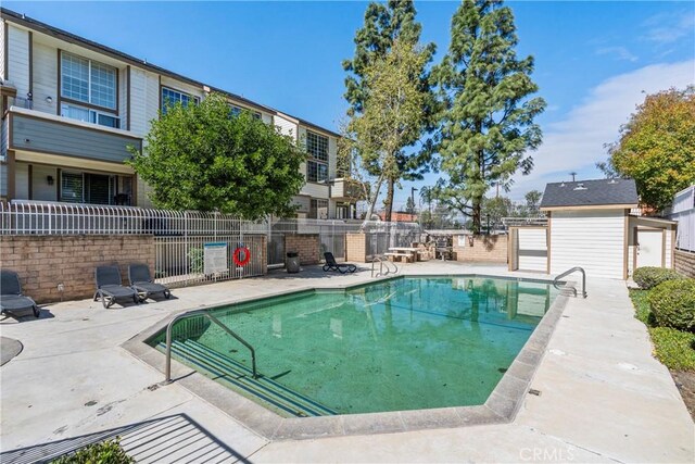 11150 Glenoaks Blvd Unit 266, Pacoima, CA 91331 - community pool featuring a patio area and fence