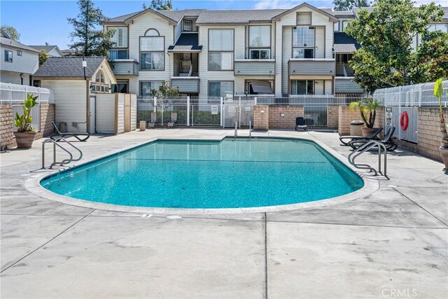 11150 Glenoaks Blvd Unit 266, Pacoima, CA 91331 - pool featuring a residential view, a patio, and fence