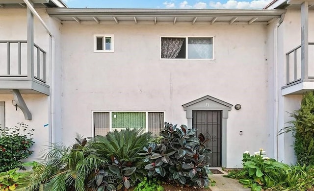 exterior space featuring stucco siding