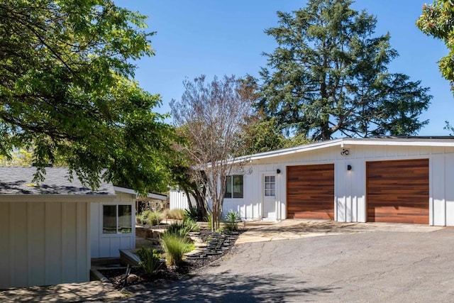 garage featuring driveway