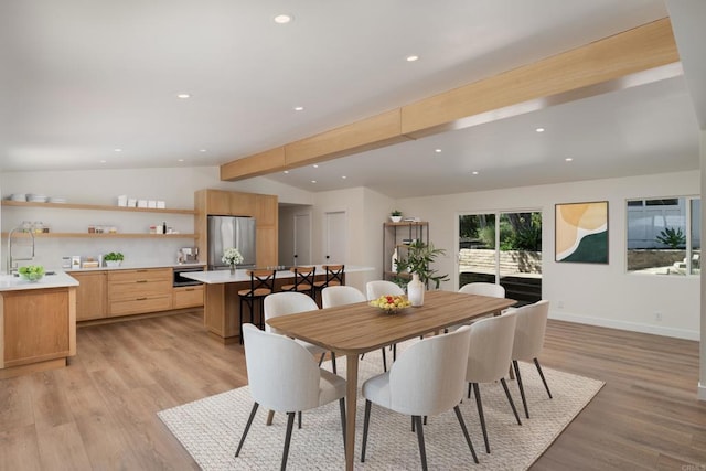 dining space with baseboards, recessed lighting, vaulted ceiling with beams, and light wood-style floors