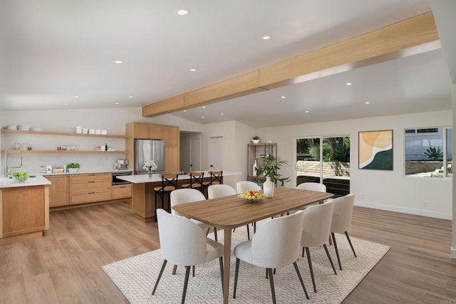 dining space with baseboards, vaulted ceiling with beams, recessed lighting, and light wood-style flooring