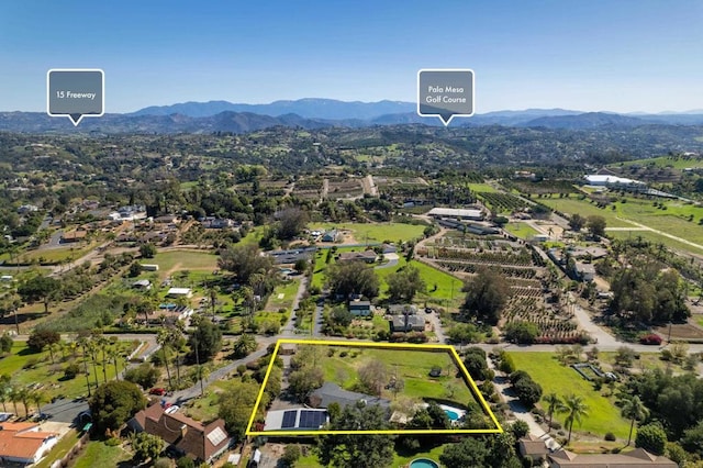 drone / aerial view featuring a mountain view