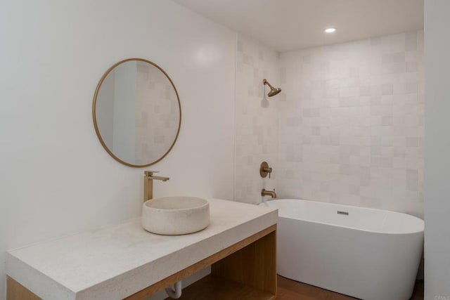 full bath with vanity, bathtub / shower combination, and recessed lighting