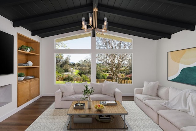 living room featuring baseboards, lofted ceiling with beams, a healthy amount of sunlight, and dark wood finished floors