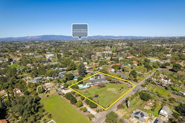 birds eye view of property featuring a mountain view