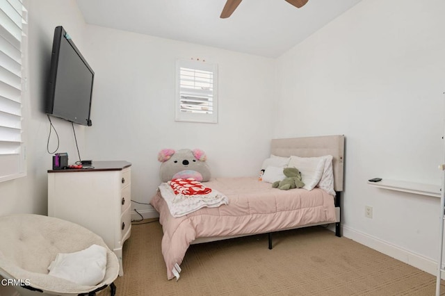 bedroom with baseboards and ceiling fan