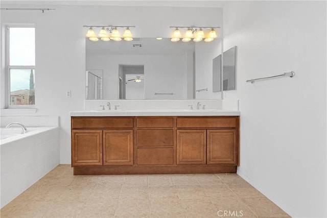 full bathroom featuring an enclosed shower, double vanity, a bath, and a sink