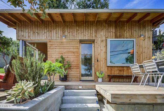 doorway to property featuring a deck