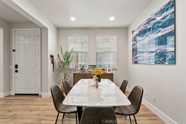 dining room featuring recessed lighting, baseboards, and light wood-style flooring