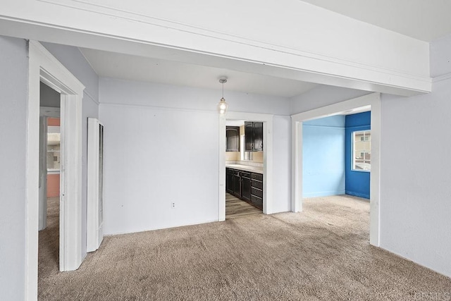 unfurnished living room featuring carpet floors