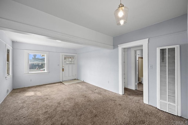 interior space featuring carpet and a heating unit