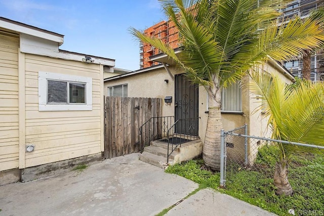 property entrance with fence