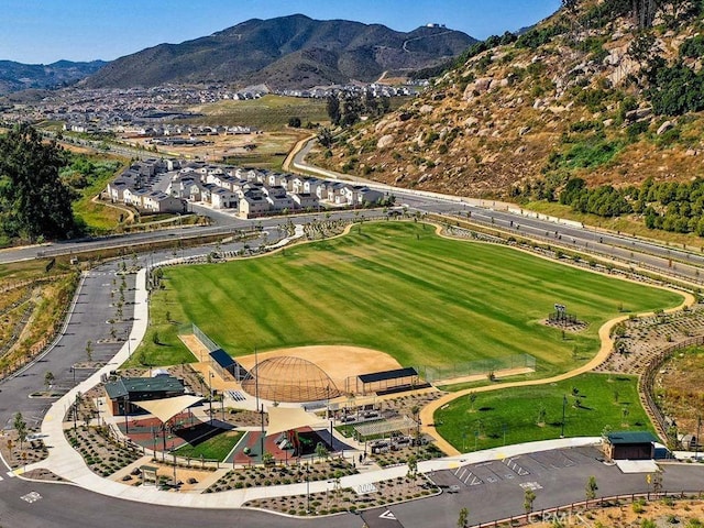 birds eye view of property with a mountain view