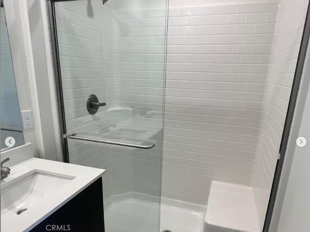 full bath featuring a shower stall and vanity