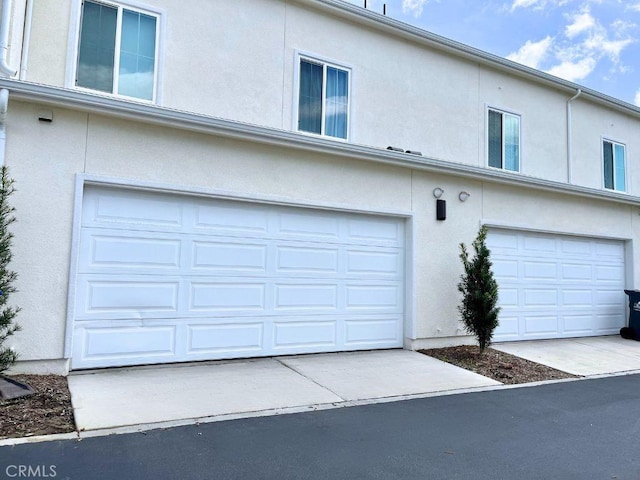 garage featuring driveway