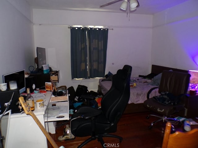 home office with ceiling fan and wood finished floors