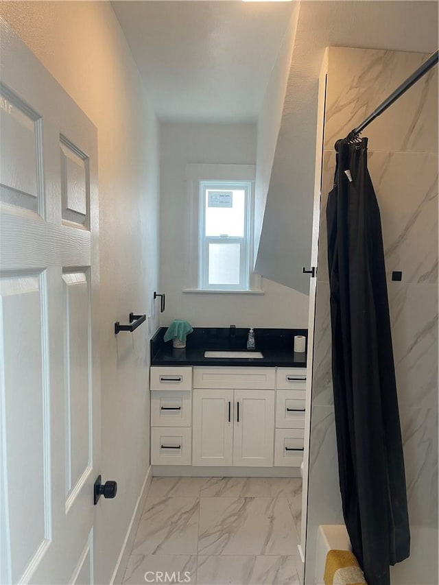 bathroom featuring baseboards, a shower with curtain, marble finish floor, and vanity