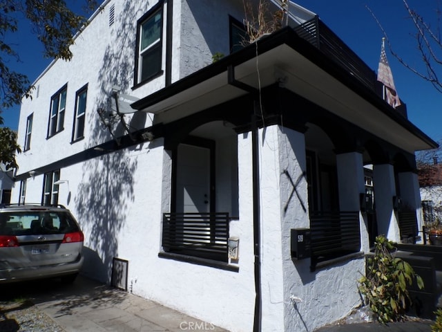 view of side of property featuring stucco siding