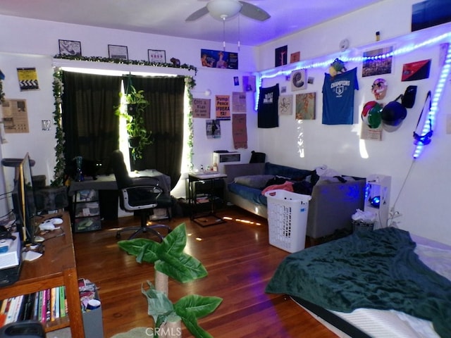 bedroom featuring ceiling fan and wood finished floors