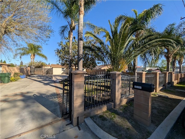 view of gate featuring a fenced front yard