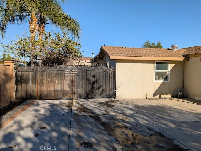 view of patio / terrace featuring a gate and fence