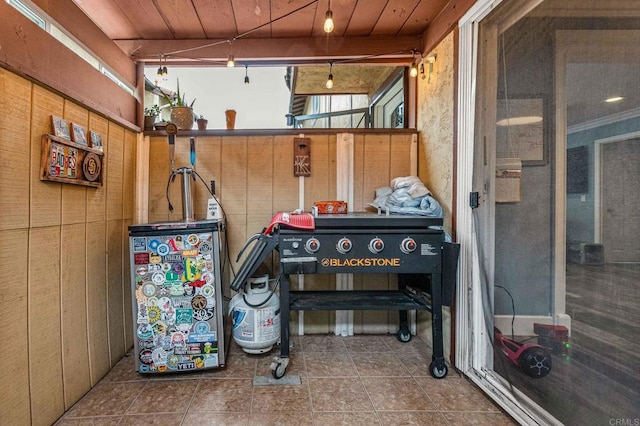 exterior space with tile patterned floors and wooden ceiling