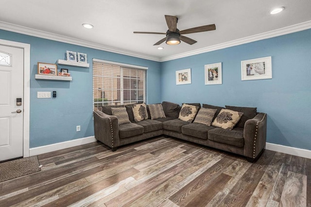 living area with ornamental molding, baseboards, ceiling fan, and wood finished floors