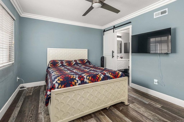 bedroom featuring visible vents, crown molding, baseboards, and wood finished floors