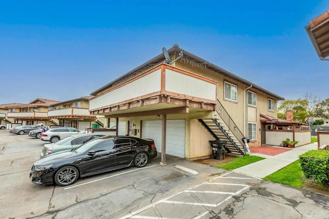 view of front of home featuring stairs and a garage