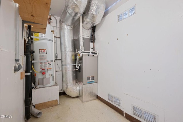 utility room with visible vents and secured water heater